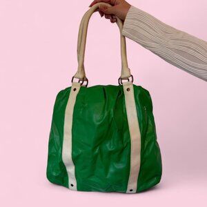 green split faux leather tote bag with cream handles and stripe accents